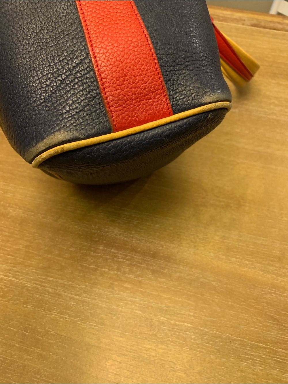 Dooney & Bourke Navy, Red & Yellow Leather Drawstring Bucket Bag - Picture 7 of 16